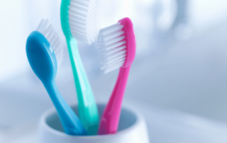 Image of three toothbrushes