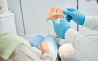 Dentist telling about upper jawbone density to the client